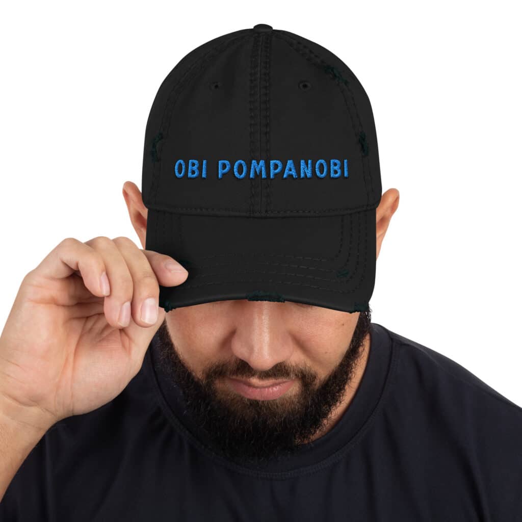 Man Wearing a Distressed Dad's Hat Obi Pompanobi Signature Logo Black Color