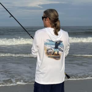 Dorman wearing a Sport-tek Performance Hoodie surf fishing back view