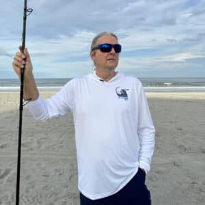 Dorman wearing a Sport-tec Performance Hoodie surf fishing front view