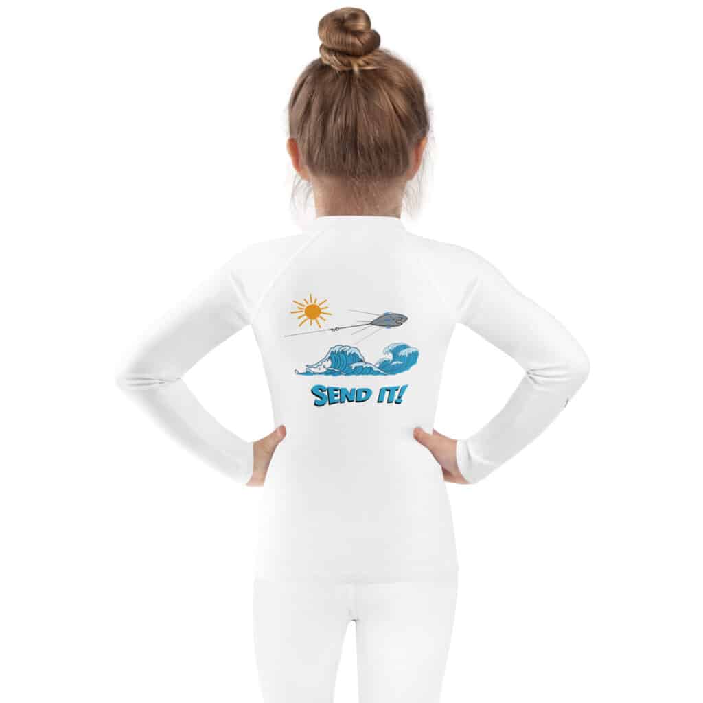 Small Child Wearing a Kid's Rash Guard with Sputnik Send It! Design White Color