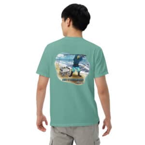 Man wearing Obi Pompanobi Fishing Beach Scene Design Seafoam color T-shirt