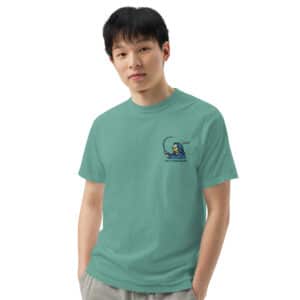 Man wearing Obi Pompanobi Fishing Beach Scene Design Seafoam color T-shirt