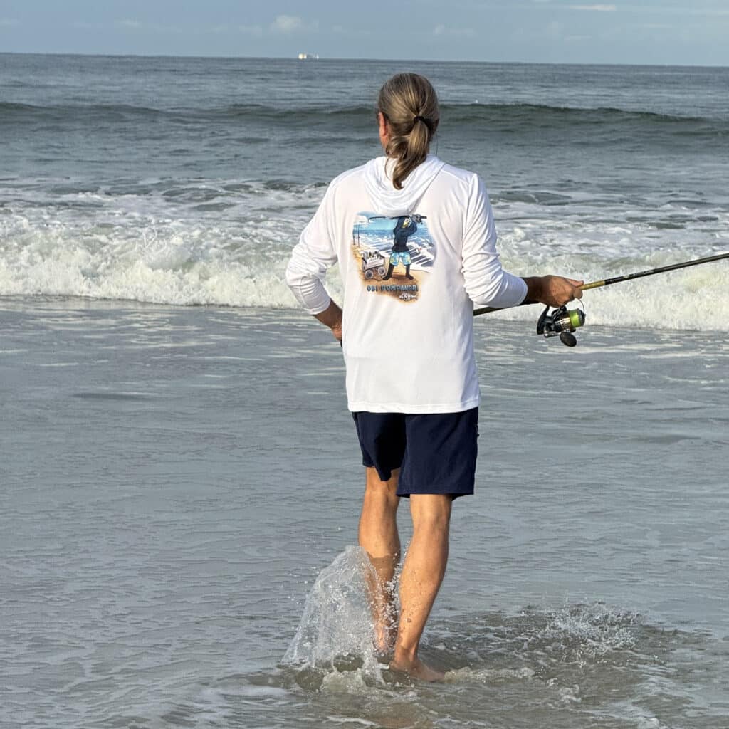 Dorman fishing wearing a Sport-tec Performance hoodie